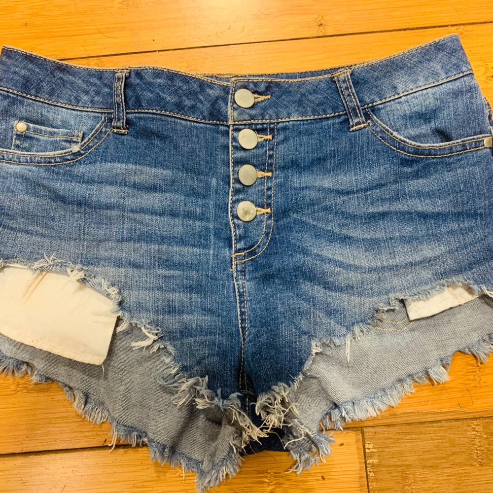 Low rise distressed denim shorts